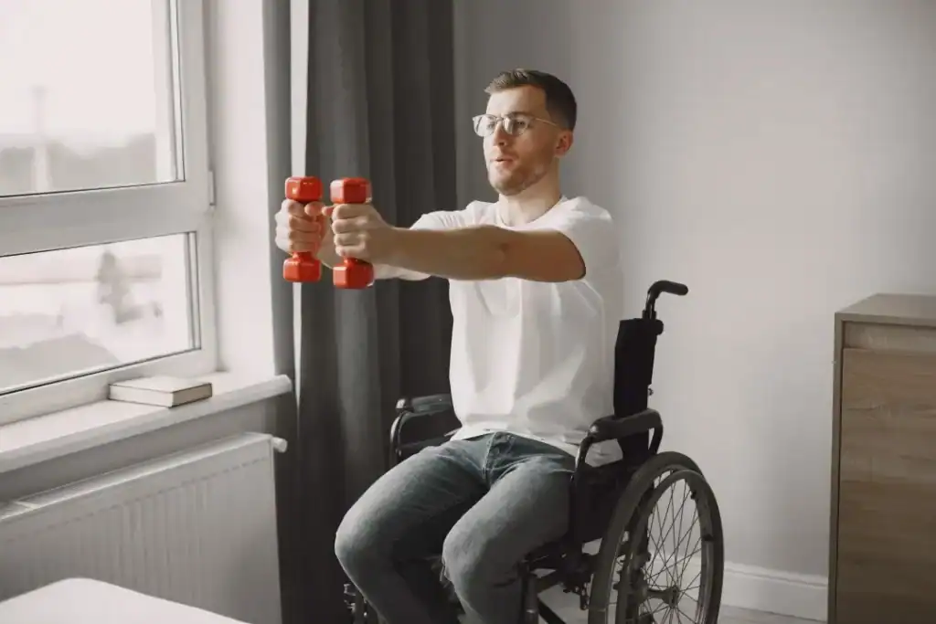 Image of man doing exercise in his wheelchair to aid weight loss Billericay