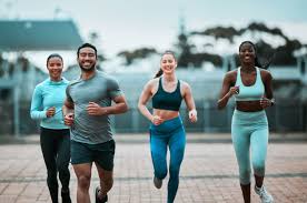 Sculpting Sleek Arms: The Essential Role of Cardio in Toning Without Bulking Up 3 image of people running to incorporate cardio Billericay exercise into their life to help tone arms and body.