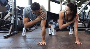 Image of man and woman doing Cardio Billericay to tone their arms. 